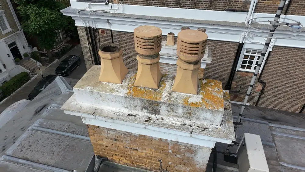 Drone view of brick chimney stack and cowl pots