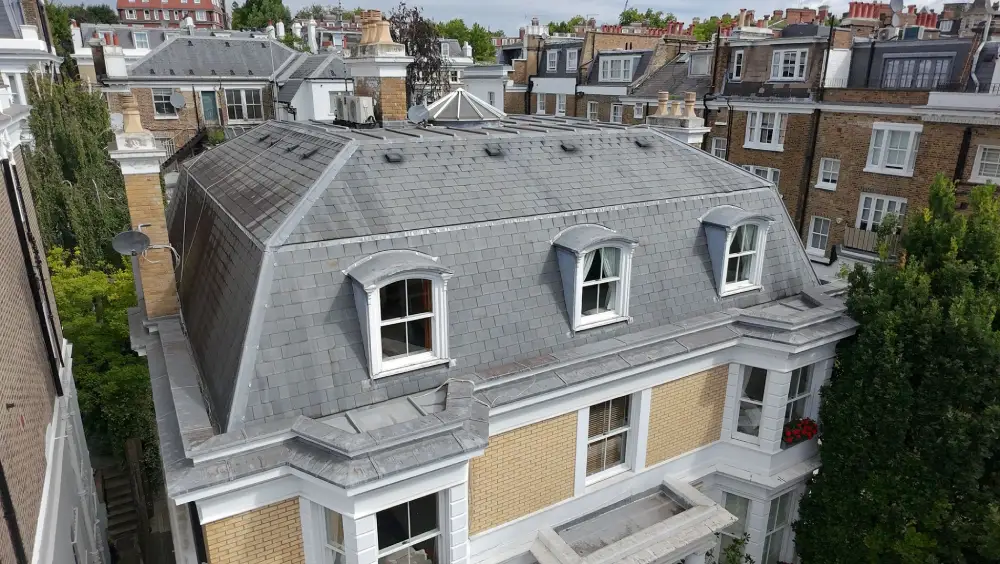 Drone view of mansard slate roof and dormer windows 1