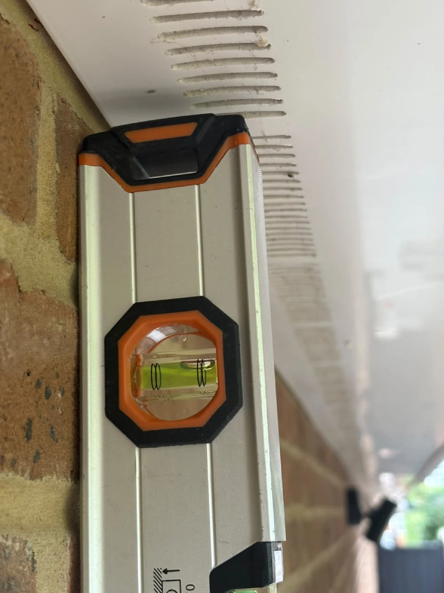 Spirit level checking alignment of new building work